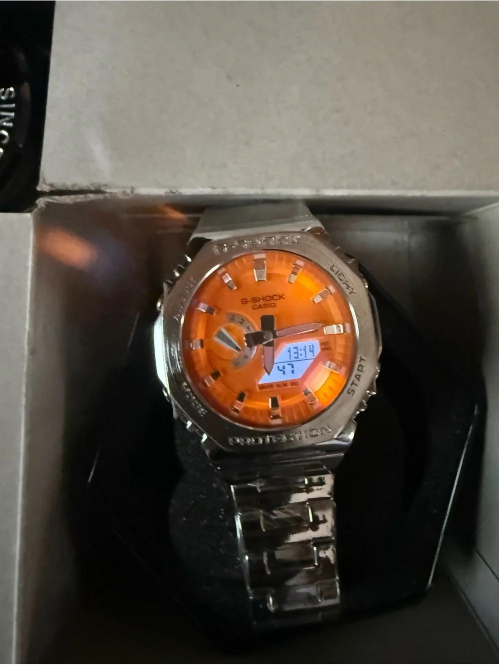 Casio G-SHOCK Silver Watch with Stylish Orange Dial